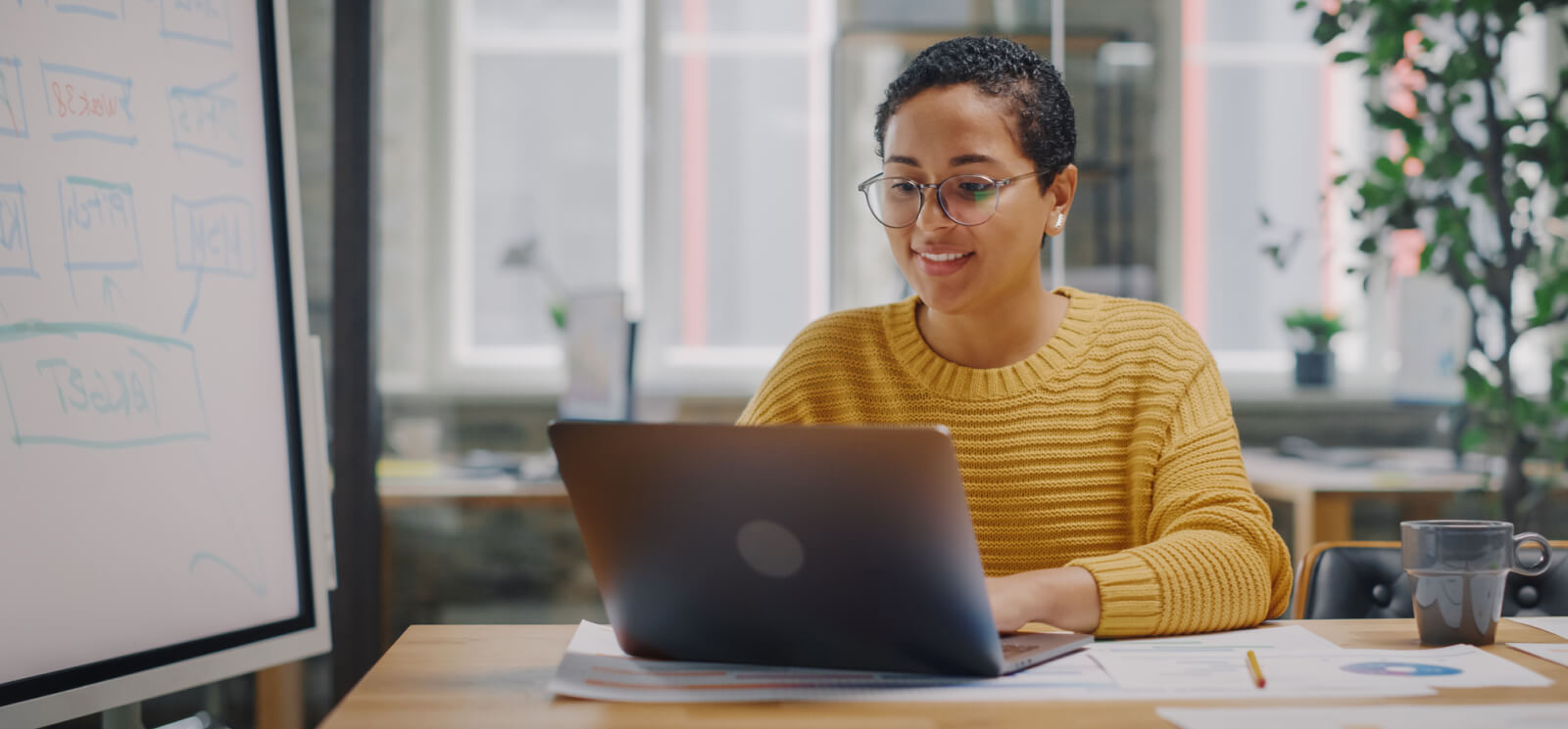 young woman working on a laptop