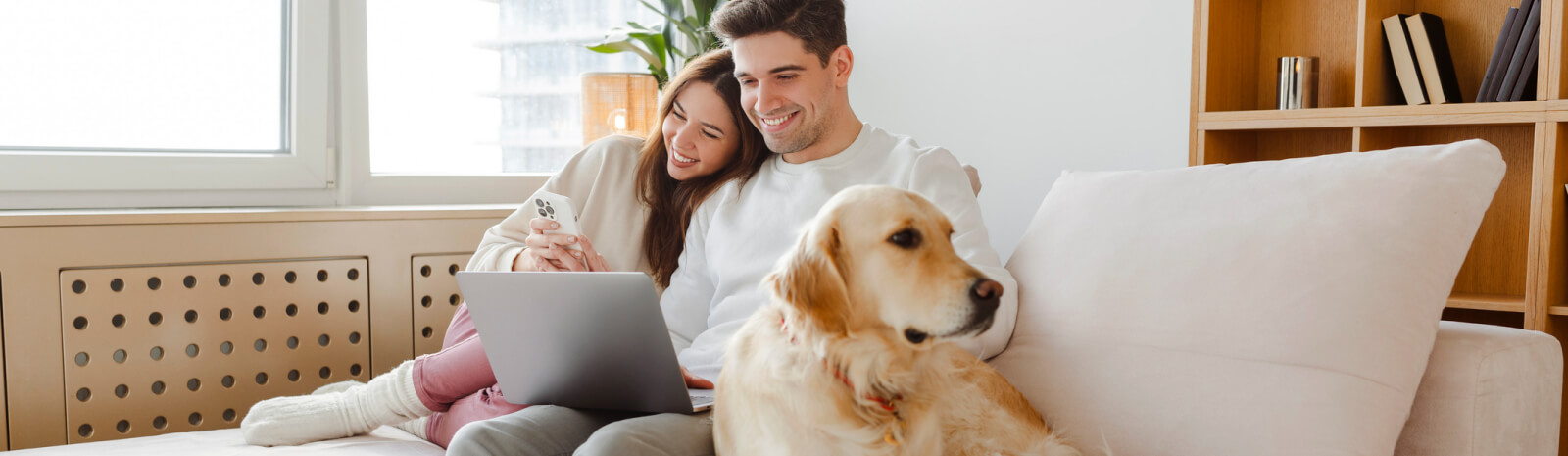 young couple looking at a laptop