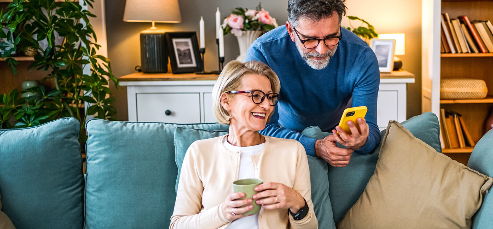 mature couple looking at a smartphone